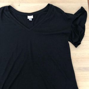 Black shirt with ruffle sleeves. Never worn